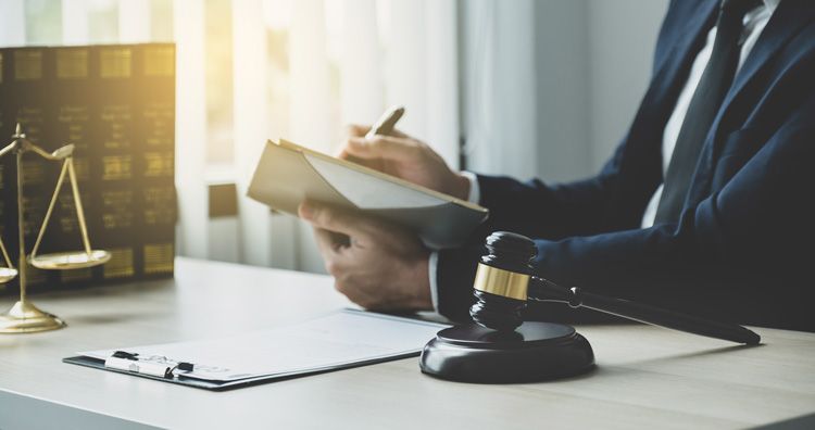 lawyer reviewing documents gavel